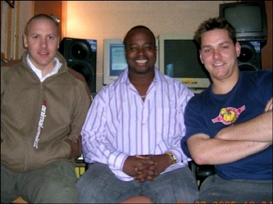 DJ Disciple sitting between Matt and Warren in the studio, in front of the monitors