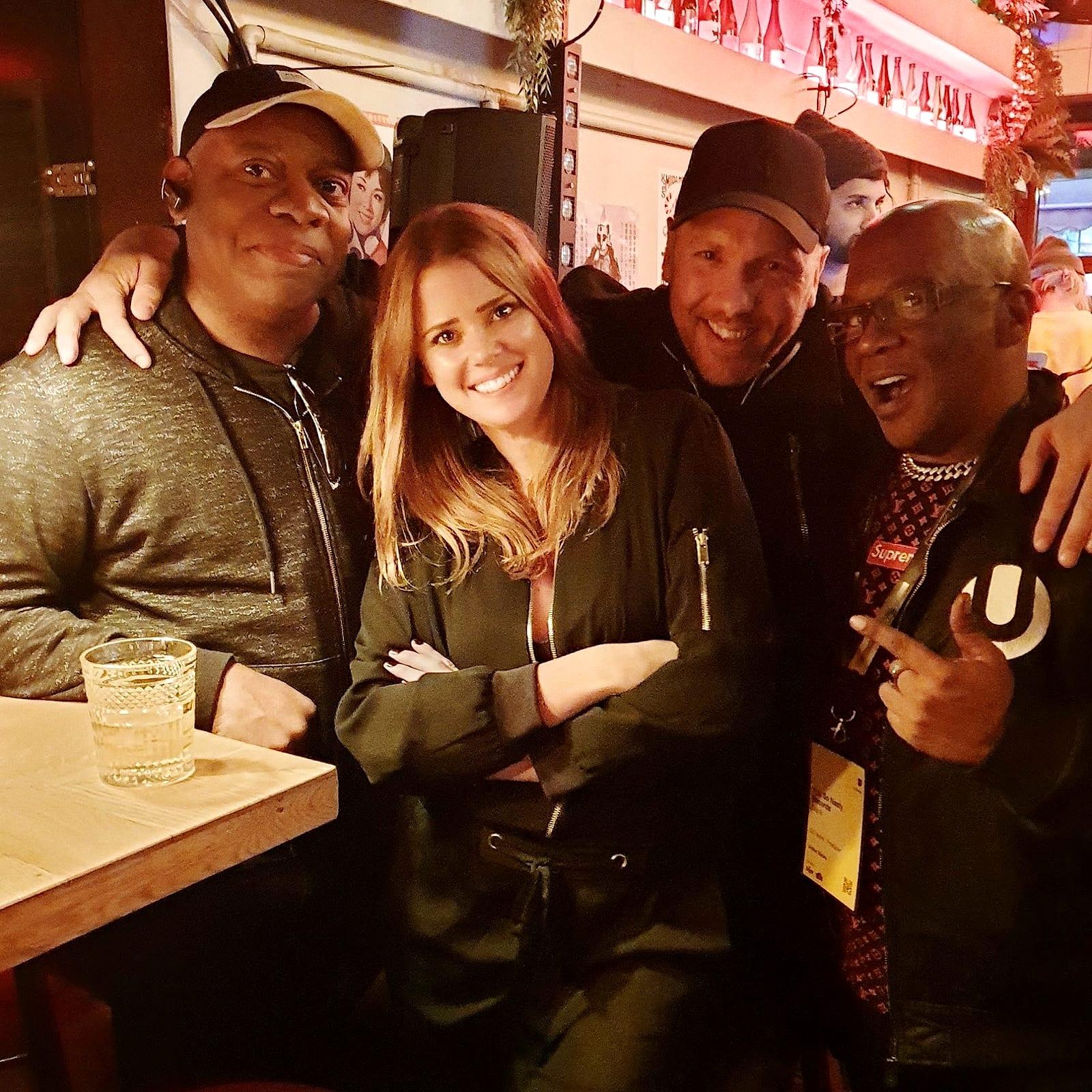 Joe Smooth, Matt's wife, Matt and Chip at a bar, arms round each other