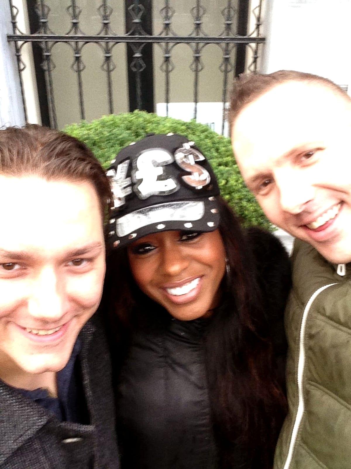 The Meyers Bros with Ultra Naté in a studded cap, in a street selfie
