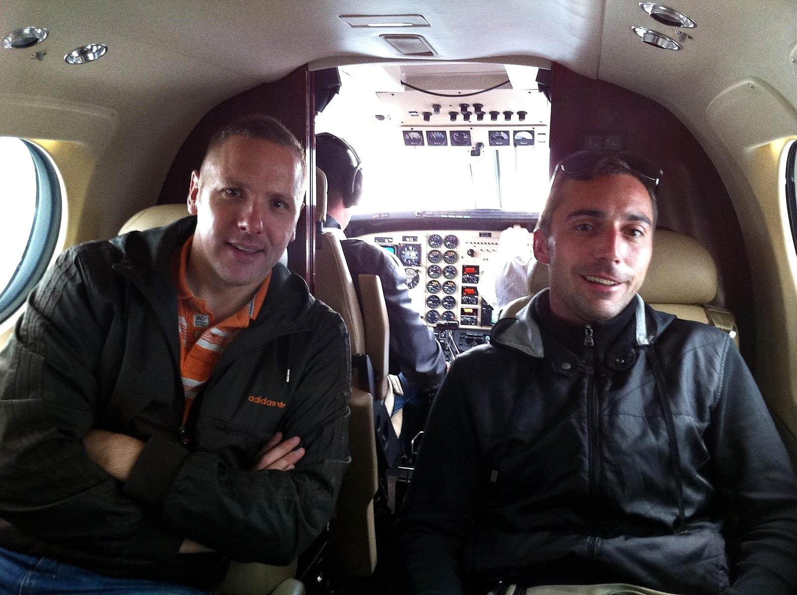 Two men on a small private plane