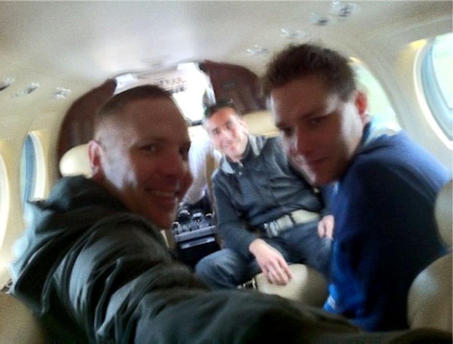 Three men on a private jet