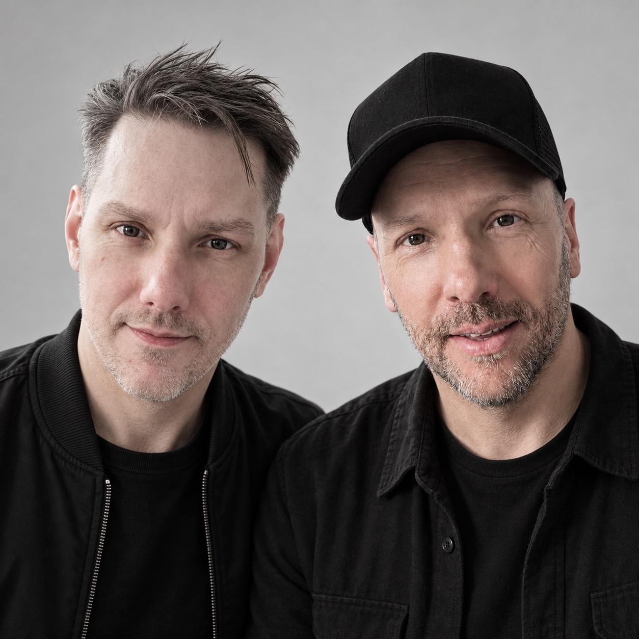 Matt and Warren Meyers, The Meyers Bros, colour portrait against a pale grey wall